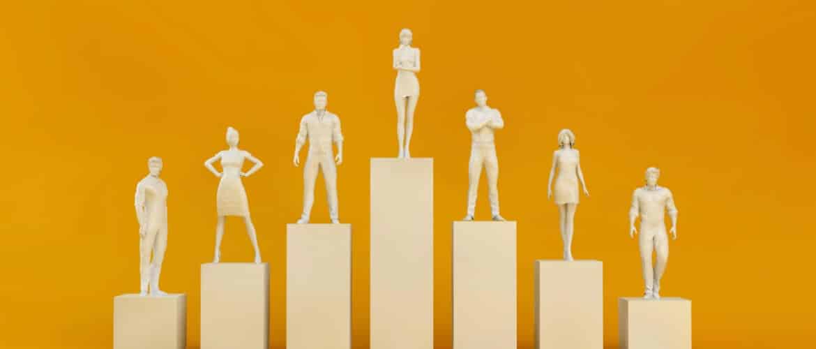 Group of figures standing on podiums of varying heights, representing different staffing levels in workforce management.