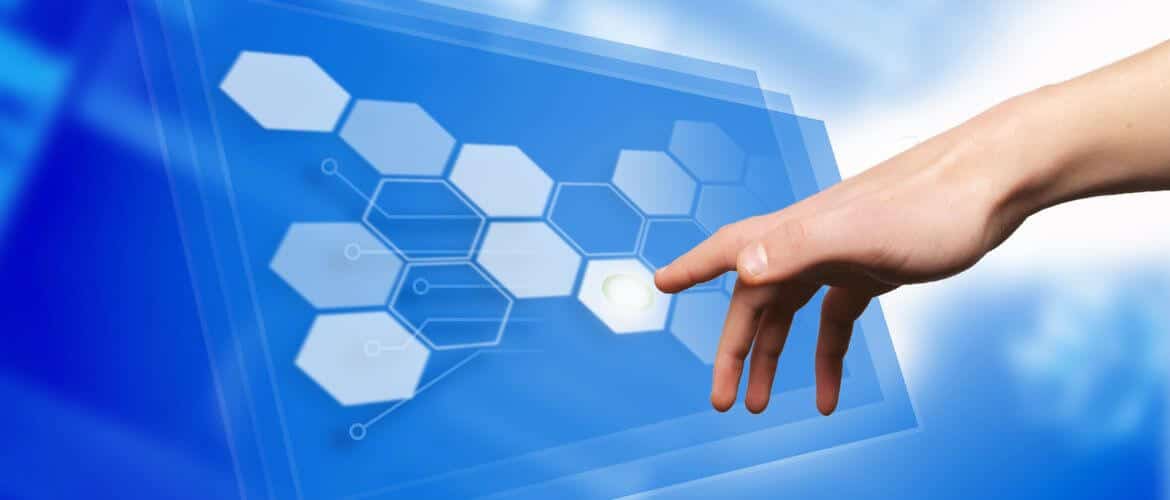 Hand interacting with a futuristic digital interface featuring hexagons and connected lines on a blue background.